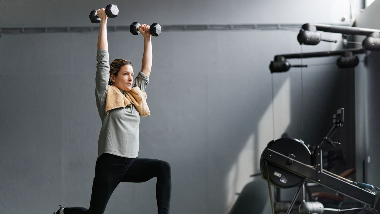 Woman exercising with dumbbells