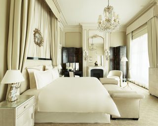 Coco Chanel suite inside Ritz-Carlton in Paris with off-white / cream bedroom decor