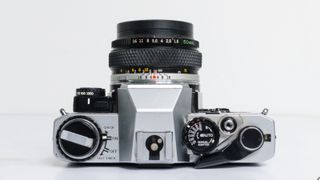 The top plate of a retro Olympus OM 10 film camera