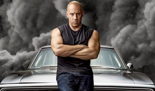 F9 Vin Diesel stands moodily in front of dark clouds