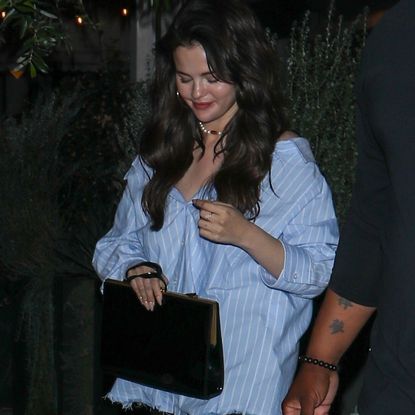 Selena Gomez on a date with benny blanco wearing an oversize Alexander Wang button-down and zara and Saint Laurent accessories