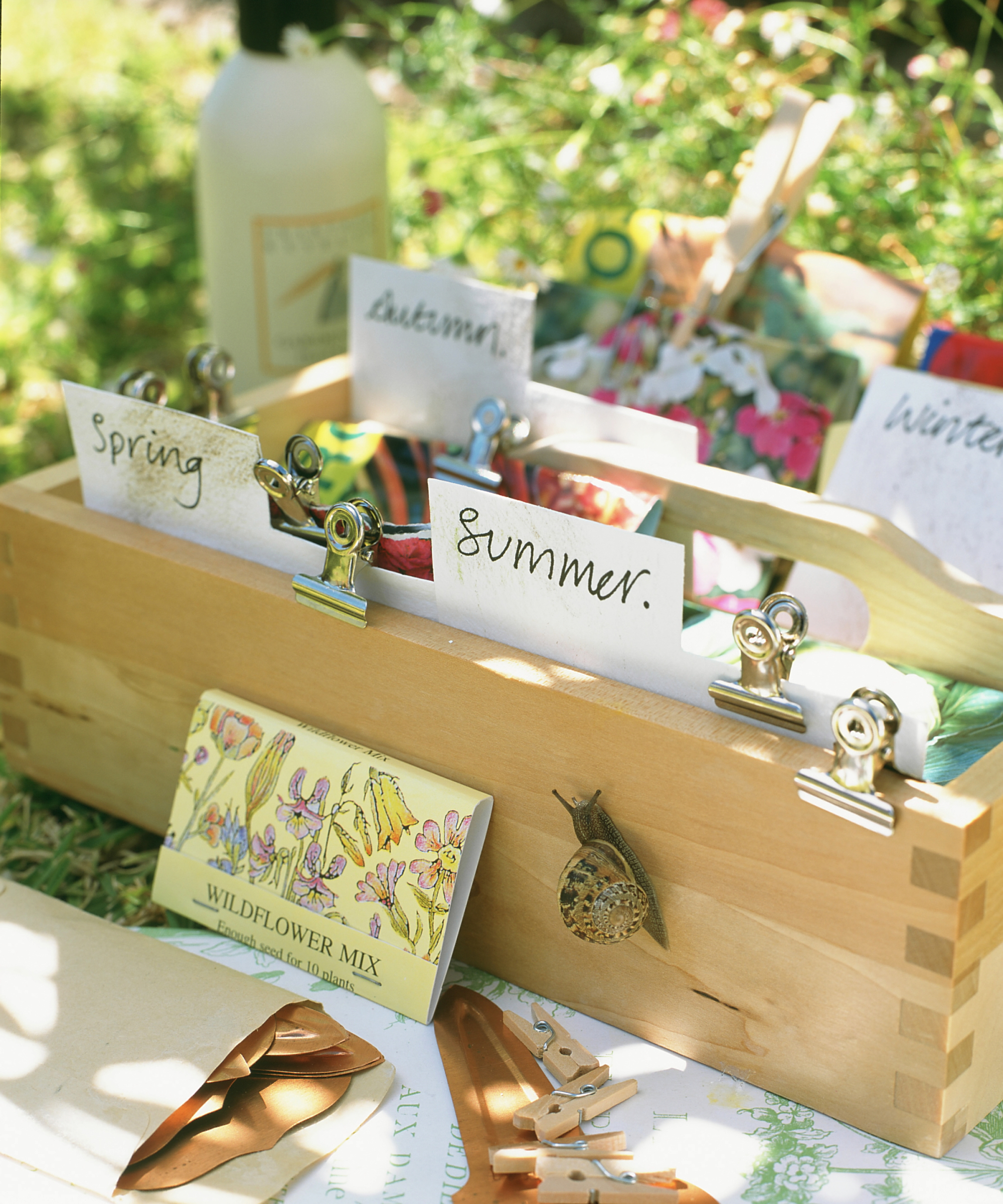 Wooden cutlery tray used for organising / storing packets of seeds.