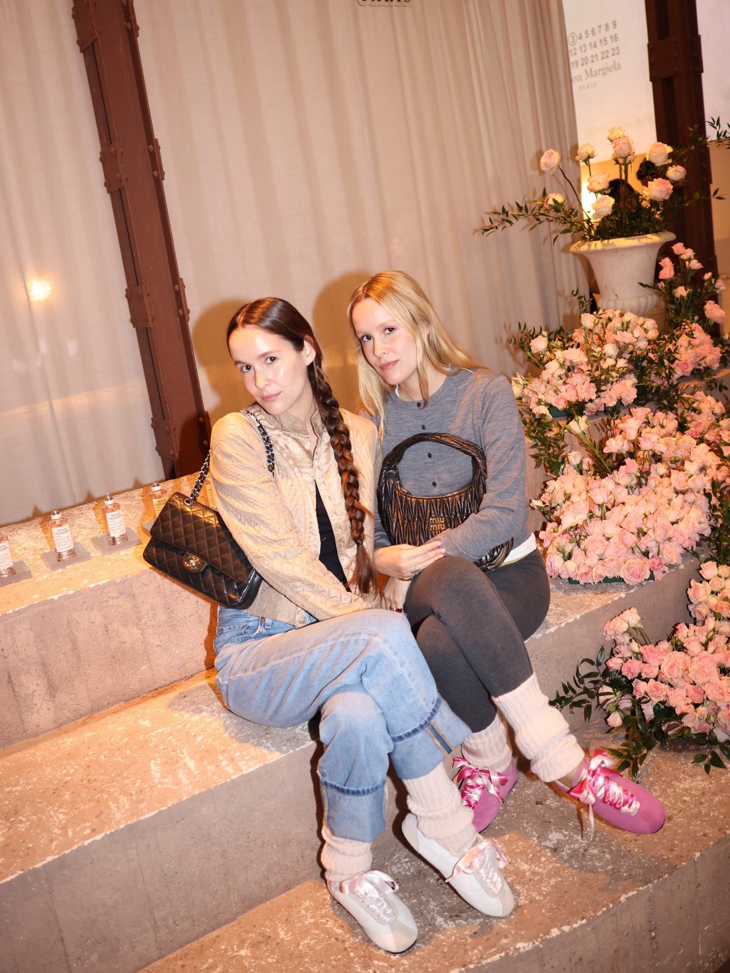 A woman wearing light pink ballet sneakers