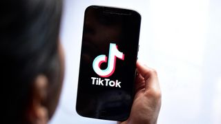 TikTok logo shown on a smartphone