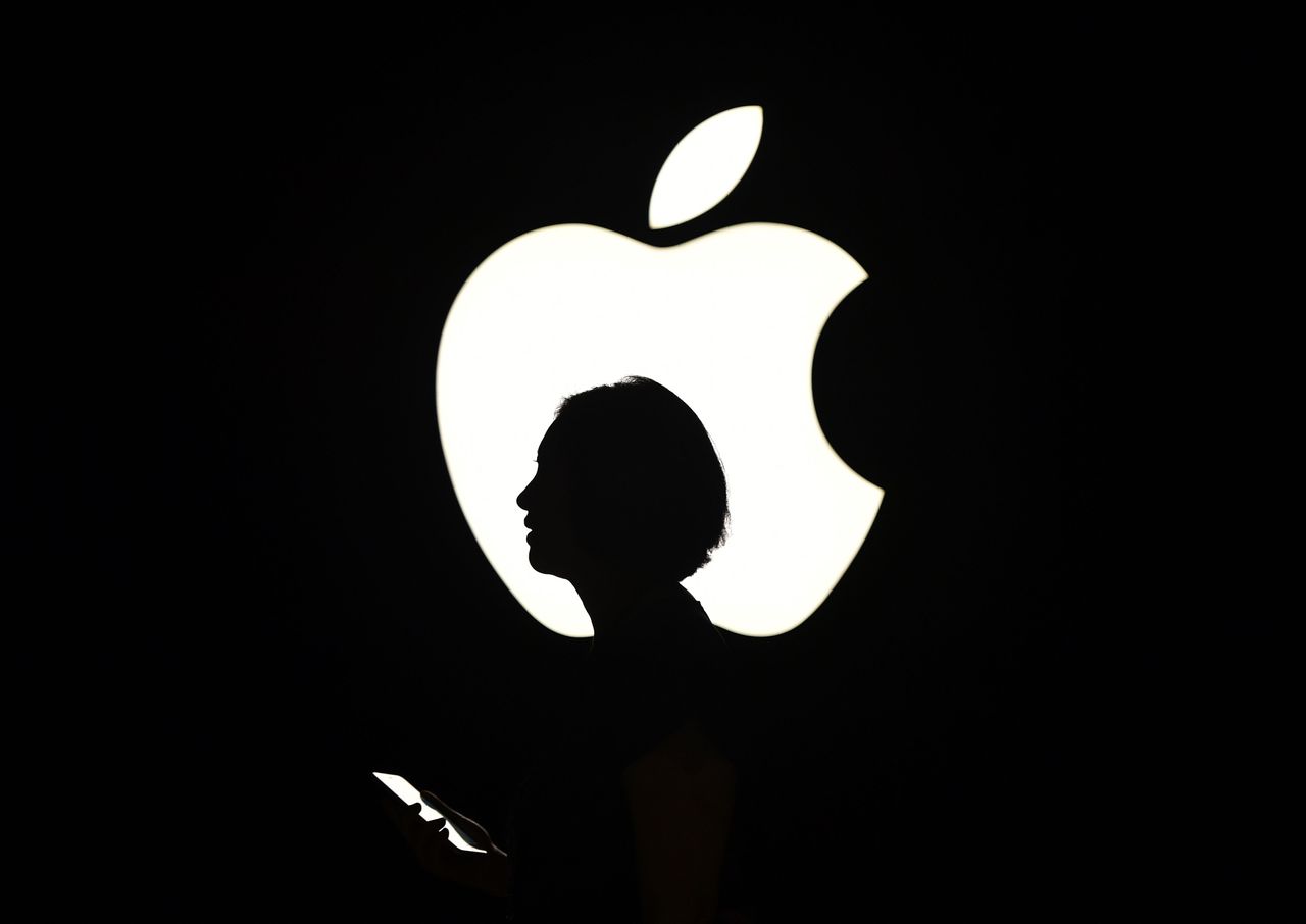 An Apple logo and a woman&amp;#039;s silhouette 