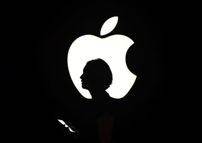 An Apple logo and a woman's silhouette 