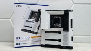 An NZXT N7 Z890 motherboard on a desk with port covers removed.