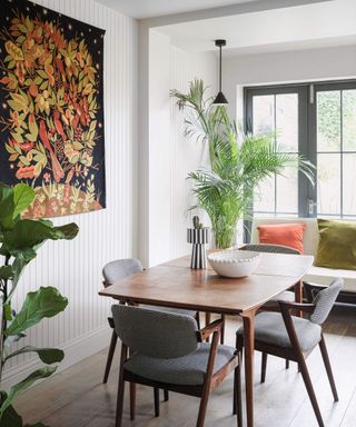 White dining room with bold artwork