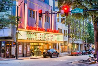 Athens, Georgia, USA - August 3, 2017: People visit the historic Georgia Theatre at dusk. The venue has featured many prominent acts from the prolific Athens music scene.