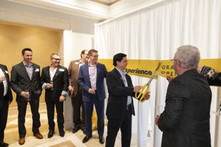 Dr. John Saw, Sprint chief technology officer, cuts the ribbon to the Sprint 5G Experience