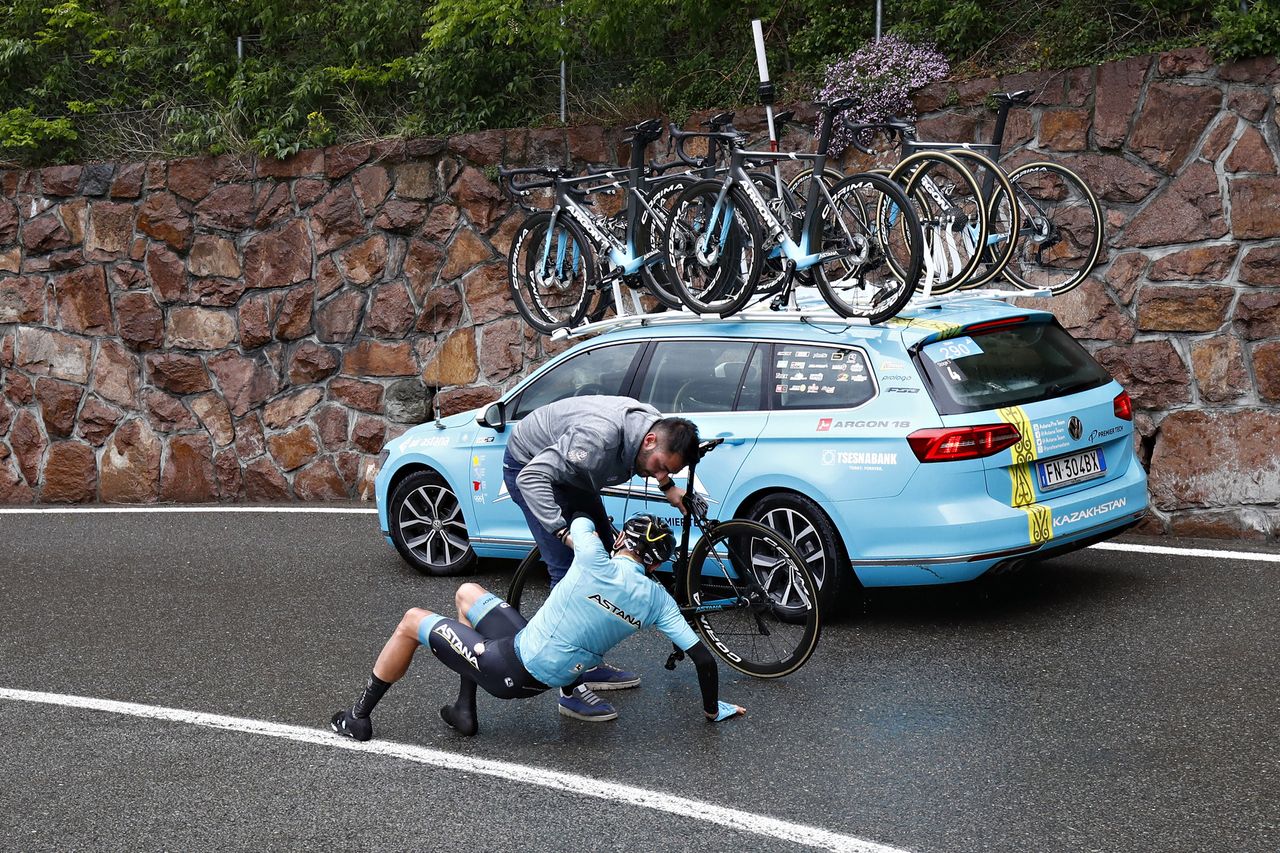 Nikita Stalnov (Astana) is helped up after a crash