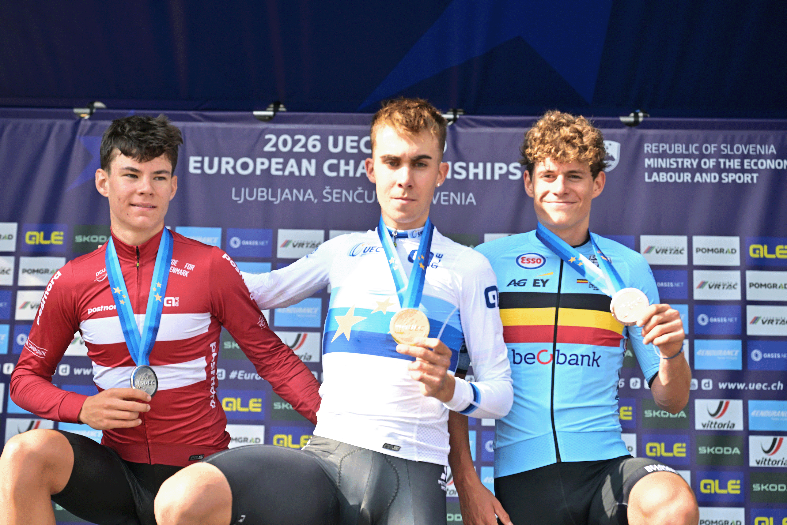 Denmark's Malthe Risbjerg; Spain's Benjamin Noval Suarez and Belgium's Vic De Smet celebrate on the podium of the Men Junior Individual Time Trial race (22km) at the cycling UEC Road European Championships, in Ljubljana, Slovenia, on Wednesday 7 October 2026. The UEC Road European Championships are taking place from 02 to 07 October in Ljubljana, Slovenia.BELGA PHOTO DAVID PINTENS (Photo by DAVID PINTENS / BELGA MAG / Belga / AFP via Getty Images)