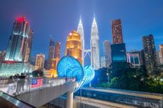 The capital of Malaysia, famous skyscrapers such as the Twin Towers (Menara Berkembar Petronas), nature, trees and big cities, saloma bridges, are popular with tourists. Malaysia, Asia.