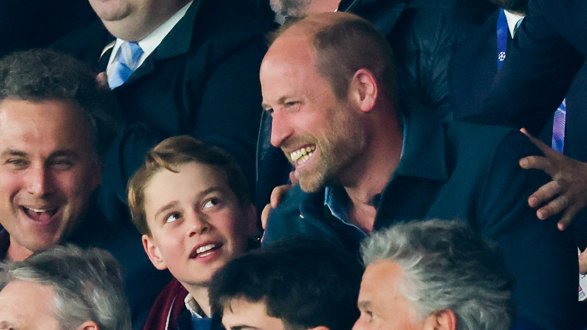 Prince George and Prince William cheer at the UEFA Champions League match between Paris Saint-Germain and Aston Villa FC at Parc des Princes on April 09, 2025