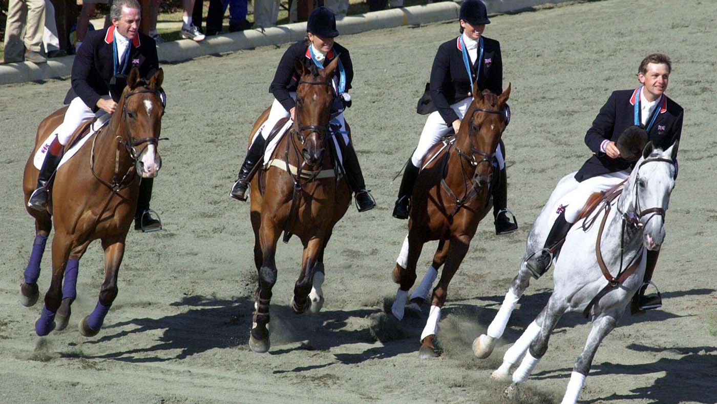TEAM THREE-DAY EVENT JUMPING, SEP 2000IAN STARK ON JAYBEE, PIPPA FUNNELL ON SUPREAM ROCK, JEANETT BRAKEWELL ON OVER TO YOU AND LESLIE LAW ON SHEAR H20 AFTER RECIVING THEIR SILVER MEDALS.