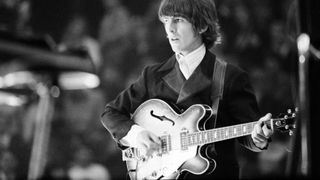 George Harrison of The Beatles playing his Epiphone Casino