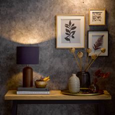 Dark grey hall with console table and photo gallery wall