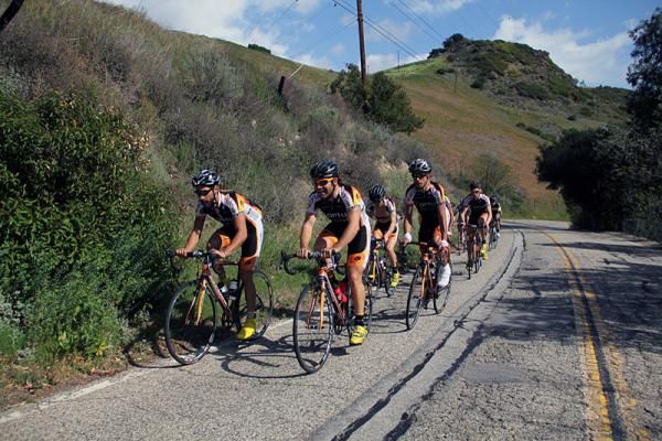 Alex Candelario, left, and Mike Friedman set the pace on a training ride in the California canyons.