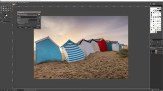 Screenshot of GIMP software editing a picture of colorful beach huts