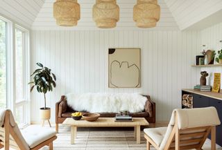 living room walls clad in white painted lap panelling