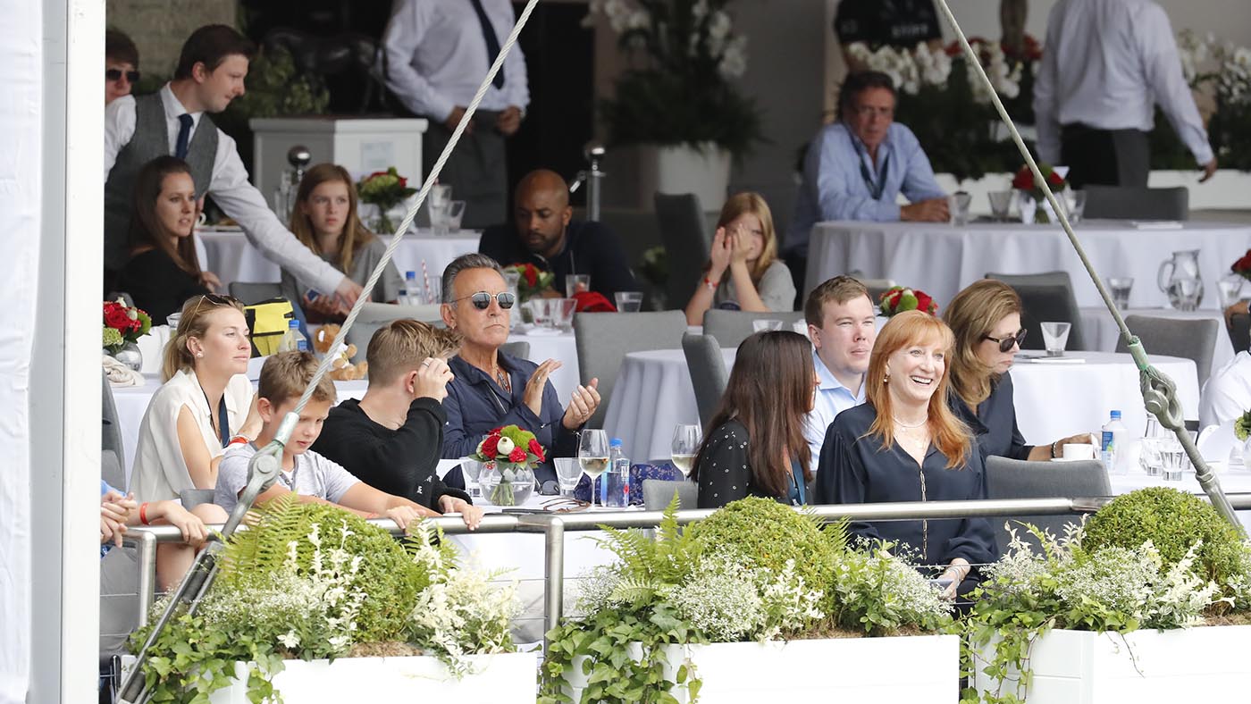 Bruce Springsteen and Patti Scialfa enjoy the competition from the elegant VIP hospitality