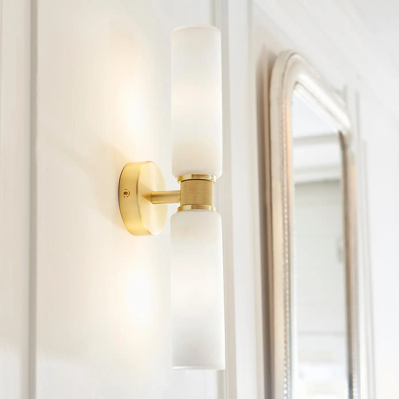 white glass and brushed gold wall light
