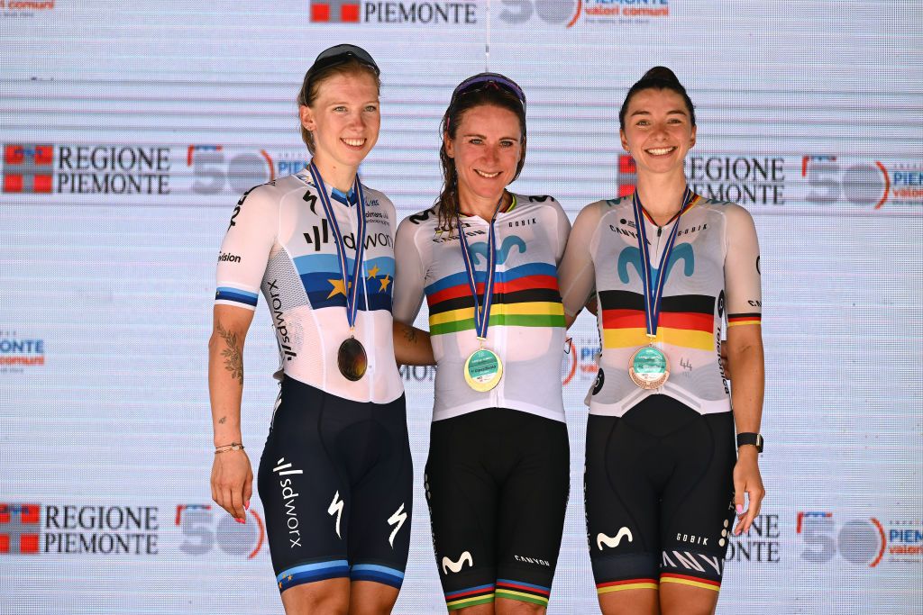CANELLI ITALY JULY 05 LR Lorena Wiebes of The Netherlands and Team SD Worx on second place race winner Annemiek Van Vleuten of The Netherlands and Movistar Team and Liane Lippert of Germany and Movistar Team on third place pose on the podium ceremony after the 34th Giro dItalia Donne 2023 Stage 6 a 1044km stage from Canelli to Canelli 315m UCIWWT on July 05 2023 in Canelli Italy Photo by Dario BelingheriGetty Images