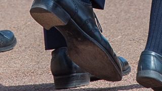 the letter w on prince william's shoe