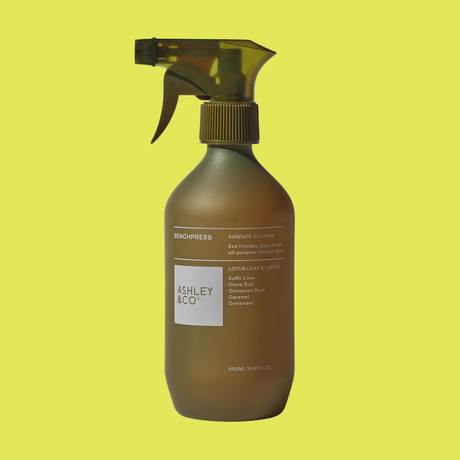 A green spray bottle of surface cleaner