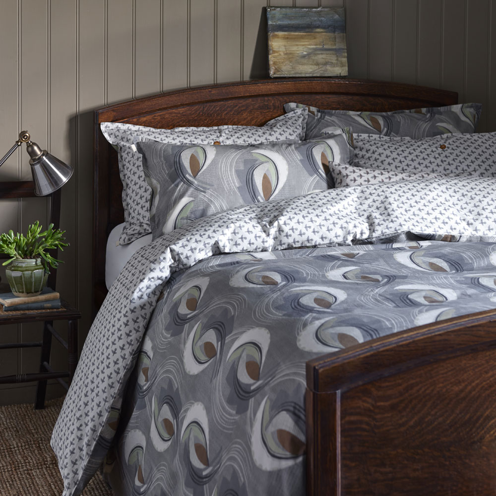 bedding with table lamp and photo frame