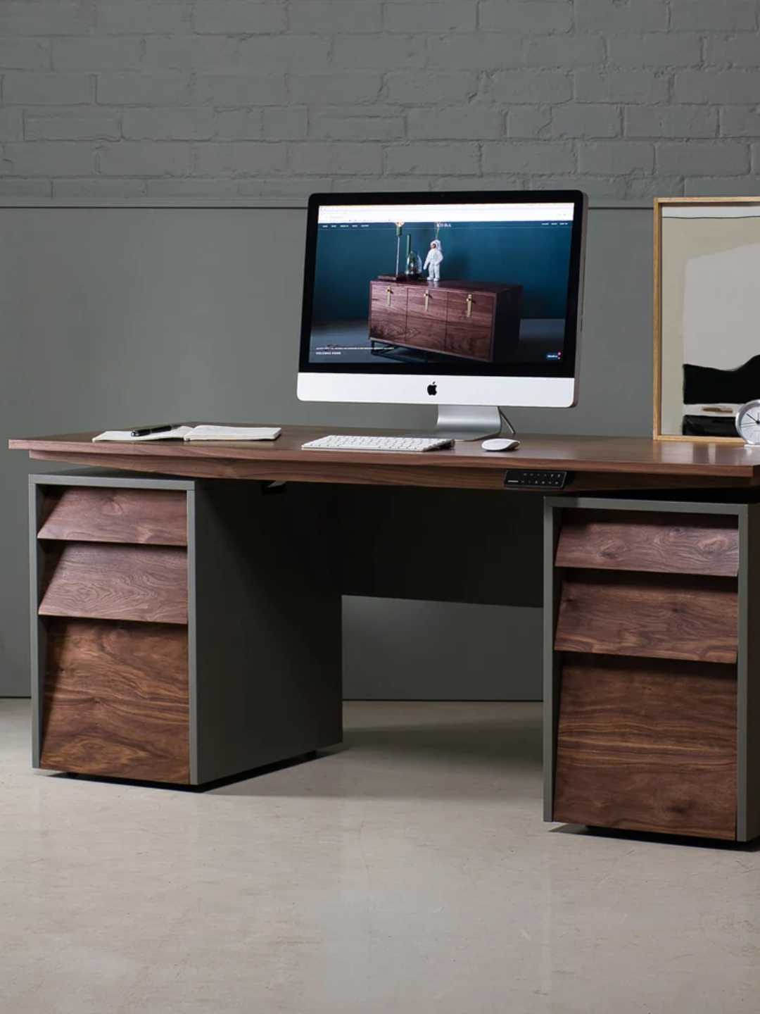 A sit-stand walnut desk from Koda with tilted drawers
