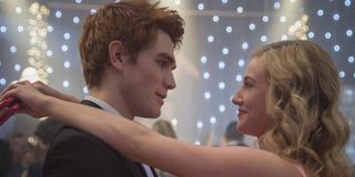 Betty and Archie dancing together in Riverdale.