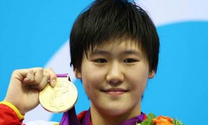 Ye Shiwen of China celebrates with her gold medal for the Women's 400m Individual Medley on July 28: Ye has denied allegations that she used performance-enhancing drugs to help her in a serie