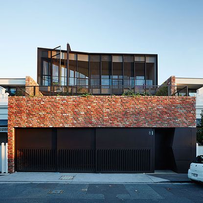 Red brick three-level townhouse in Melbourne is the brainchild of Australian architect Stephen Jolson