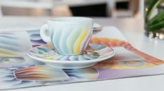 One of the best espresso cups on the market, the Illy limited edition espresso cups on a saucer