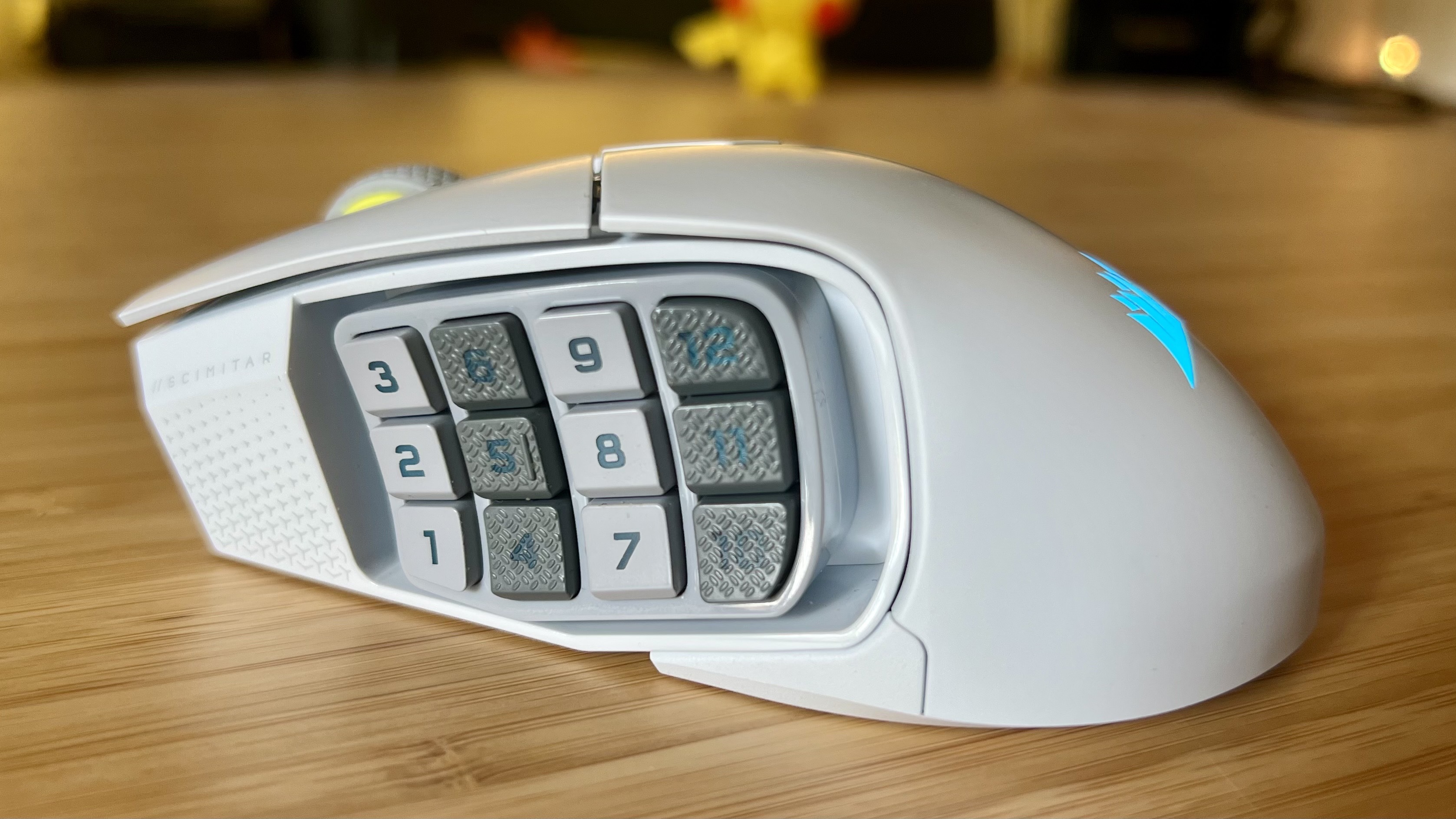 Side view of Corsair Scimitar Elite Wireless SE gaming mouse showing 12-button array