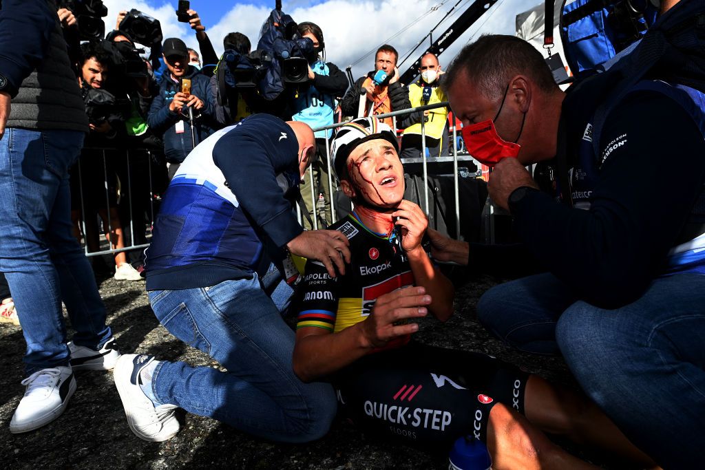 ARINSAL SPAIN AUGUST 28 Remco Evenepoel of Belgium and Team Soudal Quick Step injured after winning the stage and colliding with medic Raquel Ortolano of Spains Team Astana Qazaqstan during the 78th Tour of Spain 2023 Stage 3 a 1585km stage from Sria to Arinsal 1911m UCIWT on August 28 2023 in Arinsal Andorra Photo by Tim de WaeleGetty Images