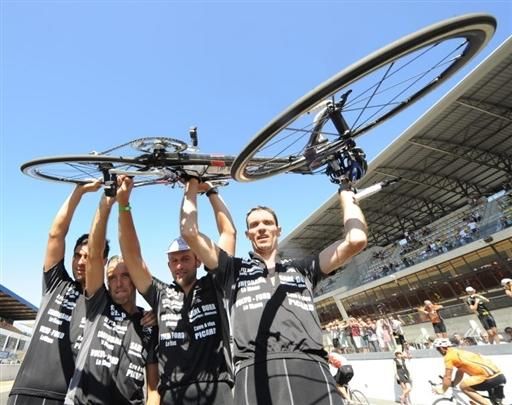 Riders from the winning team start celebrations after a long, hard race.