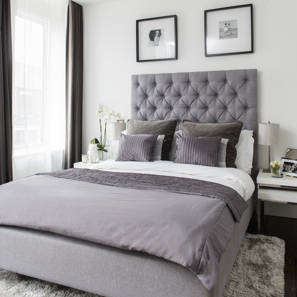 mens bedroom with shades of grey for layering from your bed to the cushions duvet and throws