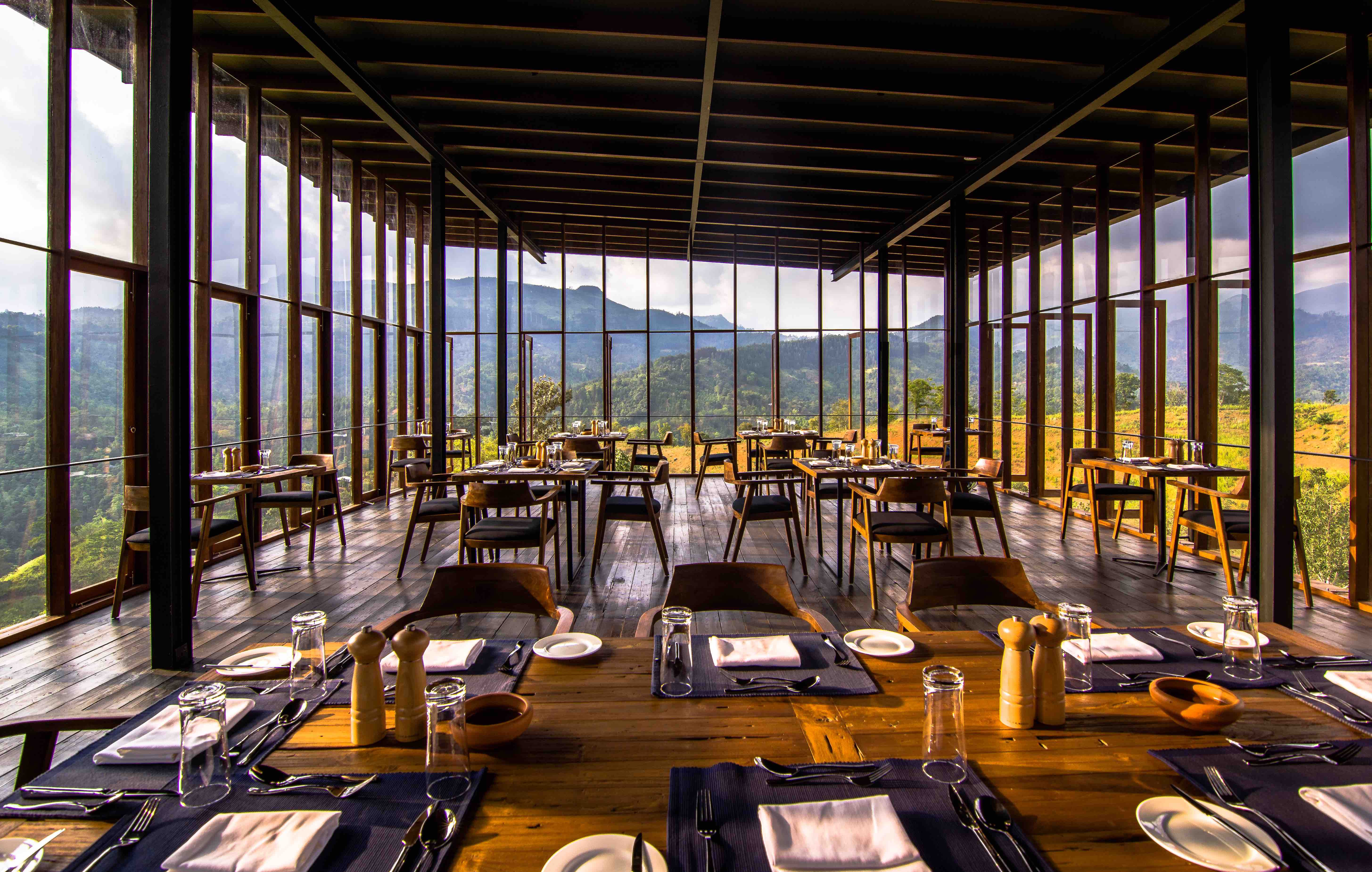 Wood and glass restaurant floating in the tree tops in Sri Lanka