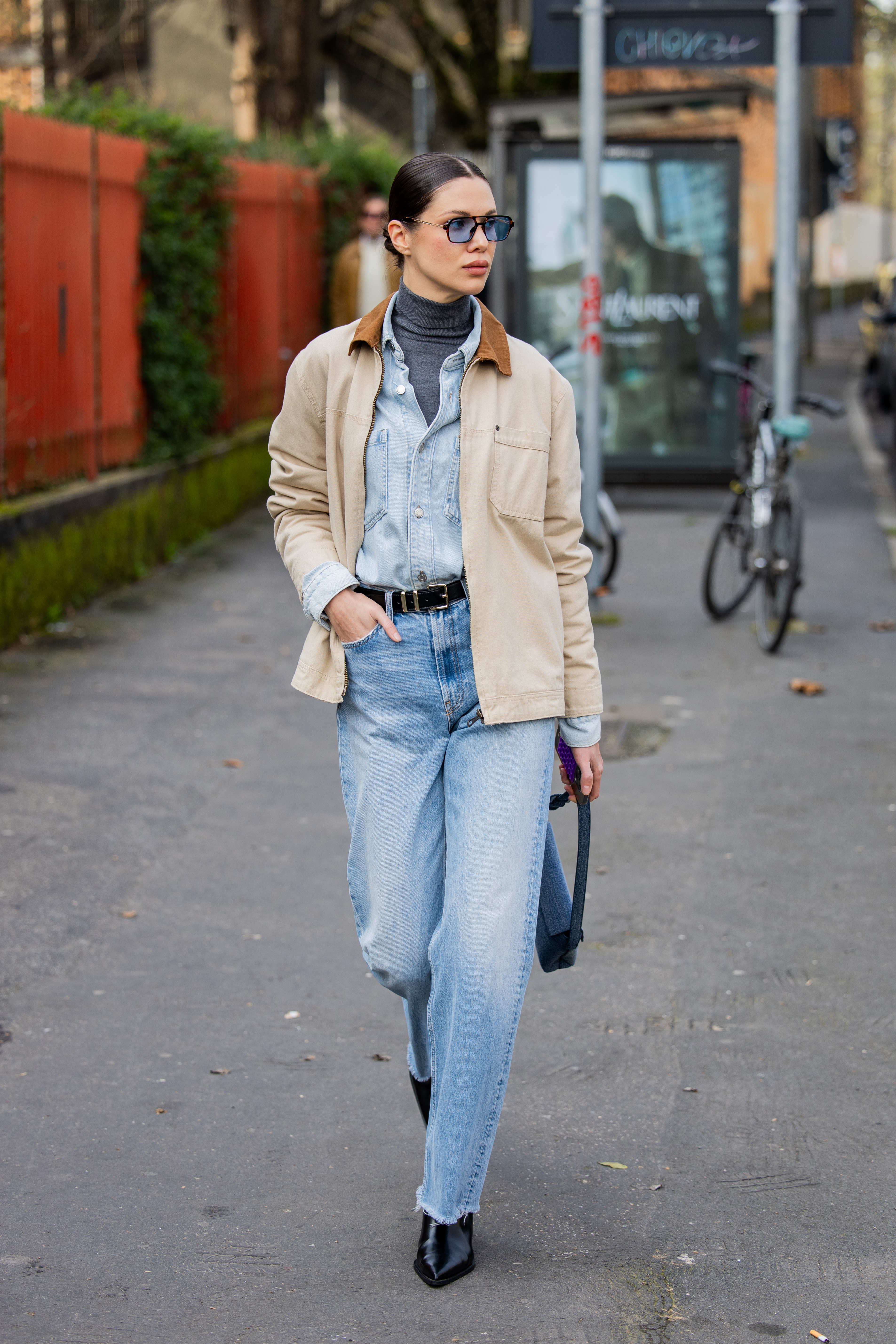 MILAN, ITALY - FEBRUARY 26: A guest wears denim shirt, jeans, beige jacket outside Diesel during the Milan Fashion Week Womenswear Fall/Winter 2025/2026 on February 26, 2025 in Milan, Italy. (Photo by Christian Vierig/Getty Images)