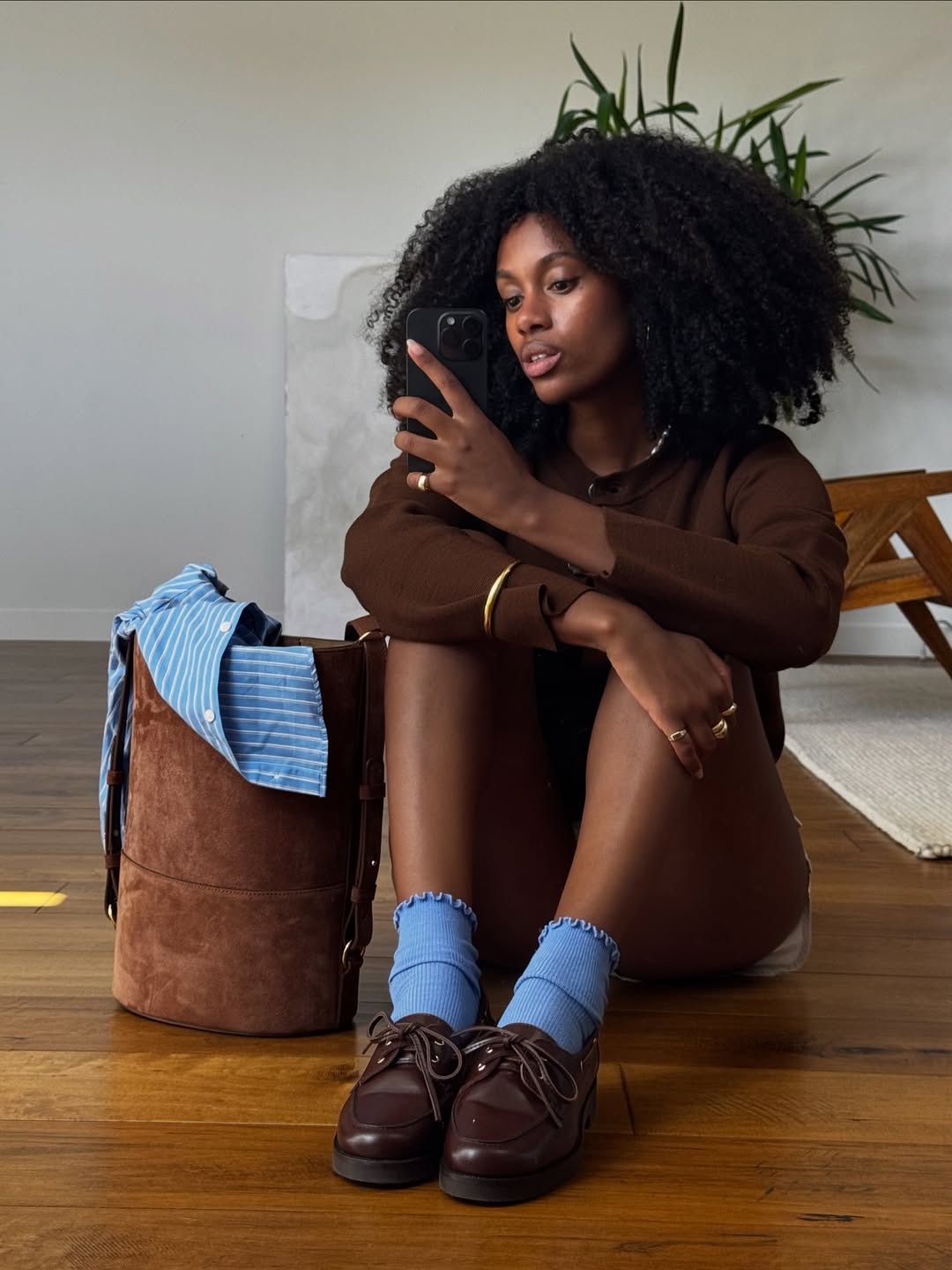 Claire in brown and blue outfit