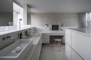 Bathroom at modern concrete japanese house by maniera architects