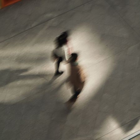 Women walking and running; through a city and on a beach.