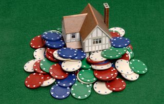 House surrounded by poker chips. Image shot 06/2005. Exact date unknown.