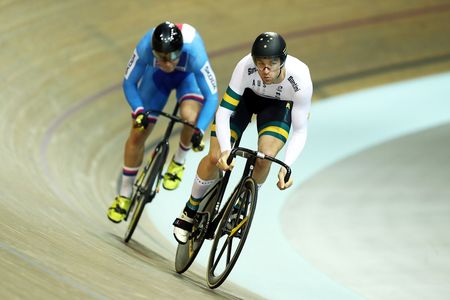 Jacob Schmid of Australia competes against Martin Cechman of The Czech Republic in the 1/16th final of the individual sprint