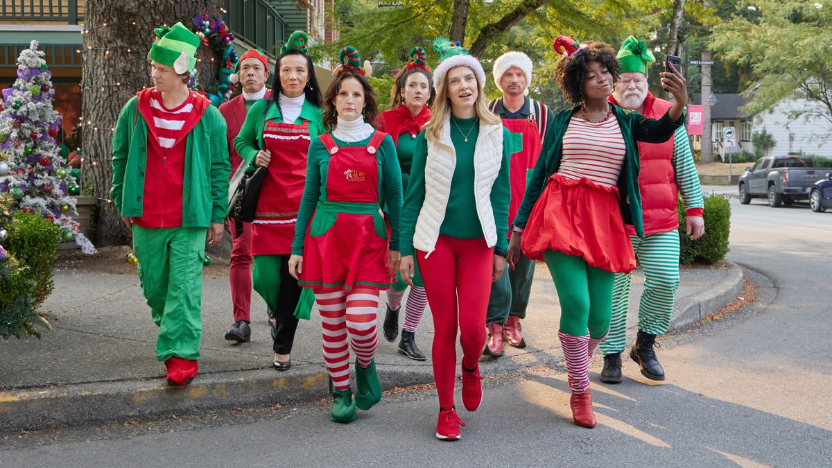 Kiefer O&#039;Reilly, Ryan Mah, Sharon Crandall, Enid-Raye Adams, Brittany Willacy, Sara Canning, Warren Christie, Princess Davis, Trevor Lerner walk across a street in elf gear in Holiday Road