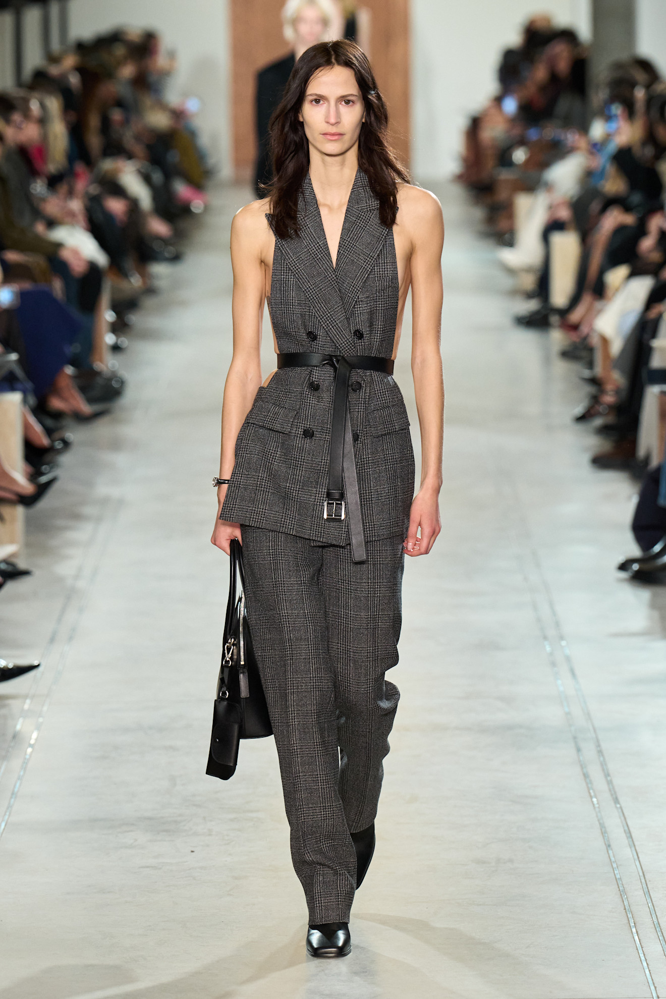 A model wore Lili&#039;s suit set on the Michael Kors Fall 2025 runway