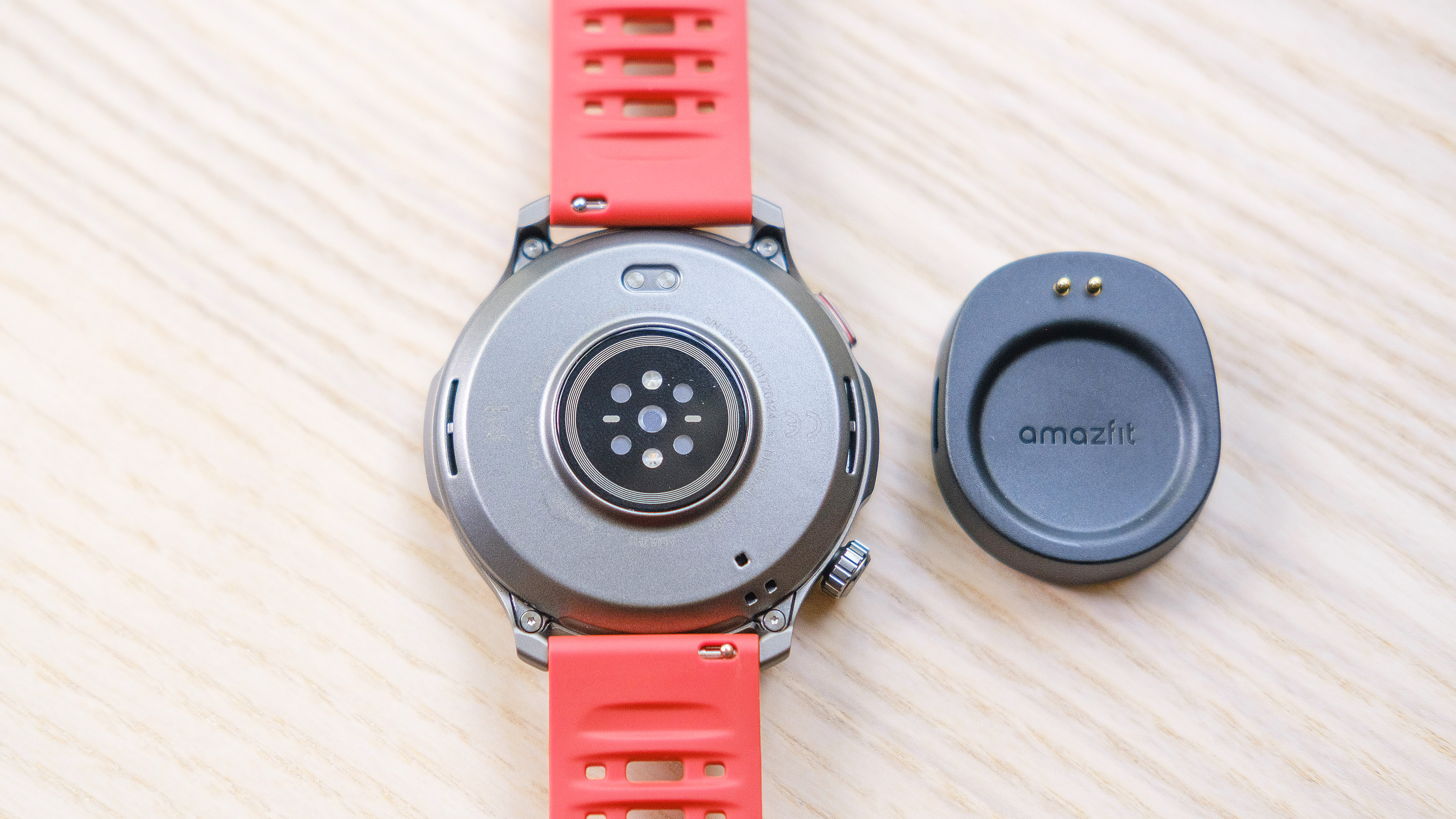 Close-up of the Amazfit Balance 2 smartwatch on an orange rubber strap