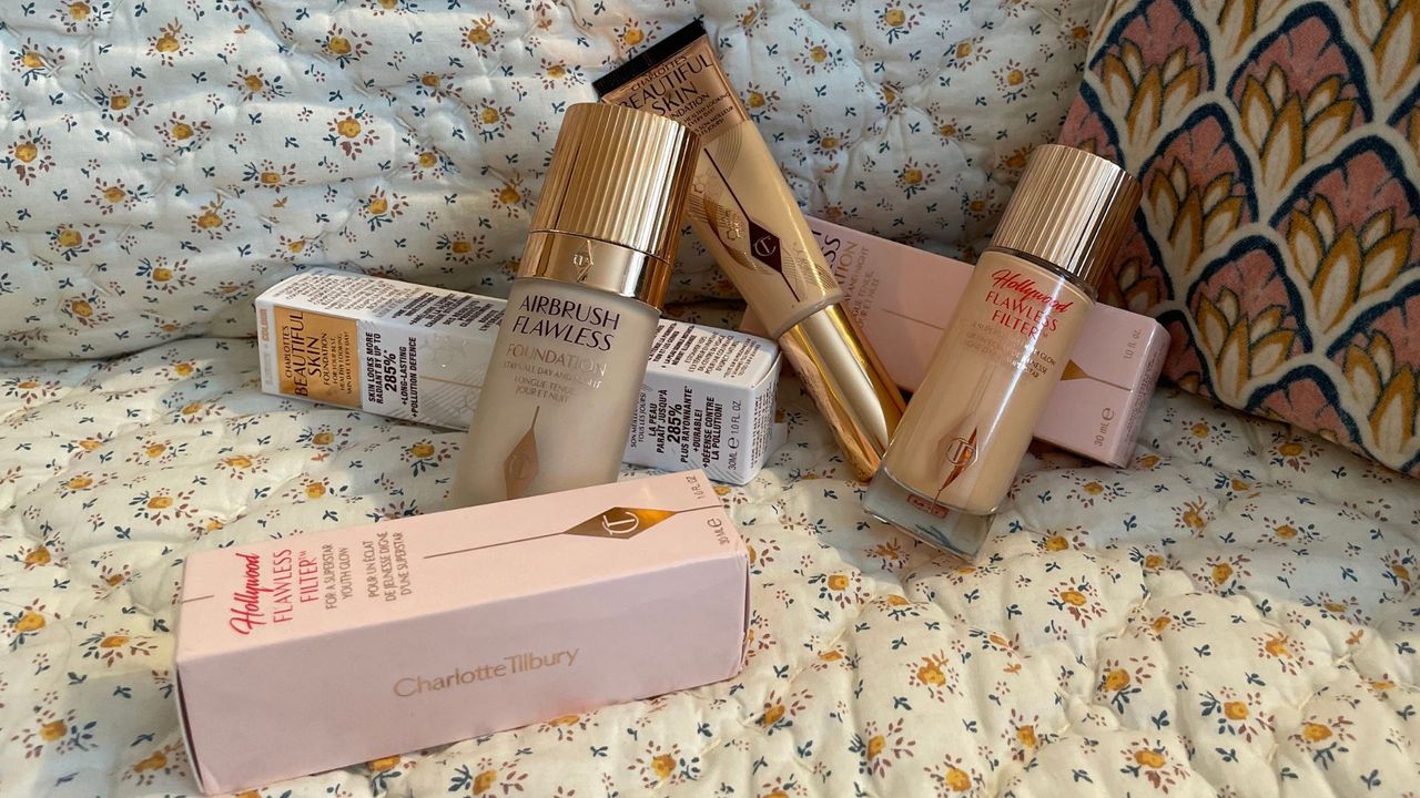 charlotte tilbury foundation - image of the three charlotte tilbury foundations scattered on a bedsheet